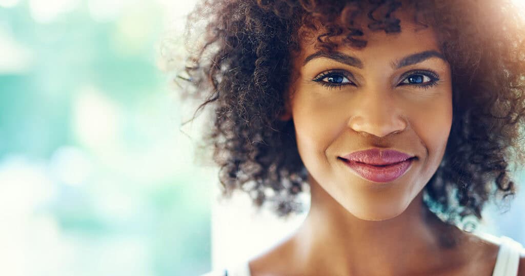 Black woman smiling at camera