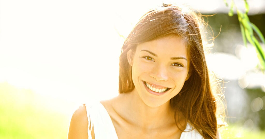 Young white woman smiling at camera