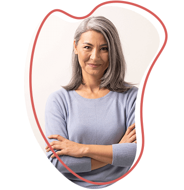 grey-haired woman smiling at camera